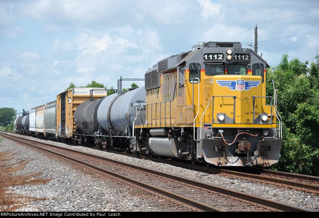 Local cruises east down the siding waiting for a meet